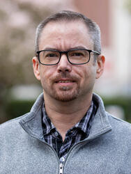 Headshot of Interim Assistant Director, Tay McEdwards